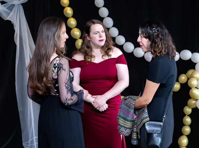 Three guests in conversation at the ASE 2026 reception