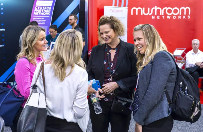 A group talking on an exhibition floor