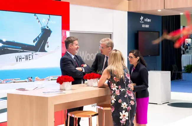 World Gas Conference — Attendees meeting at an exhibition counter
