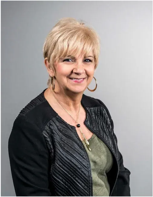 Corporate headshot on a plain white or gray background, selection 6