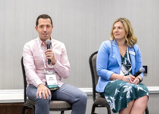 Incentive Marketing Association — Two-person discussion with microphones