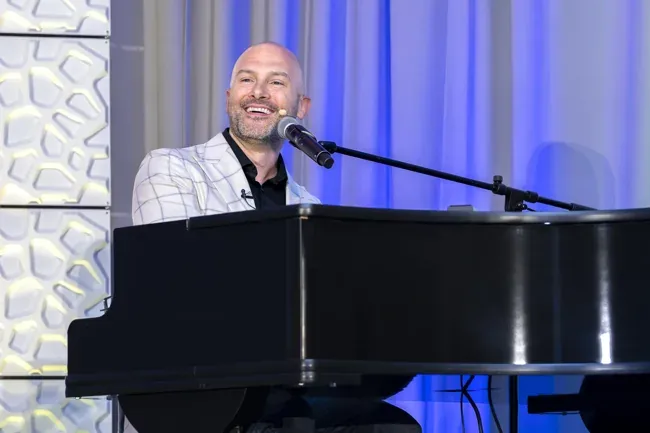 Incentive Marketing Association — Speaker at the piano
