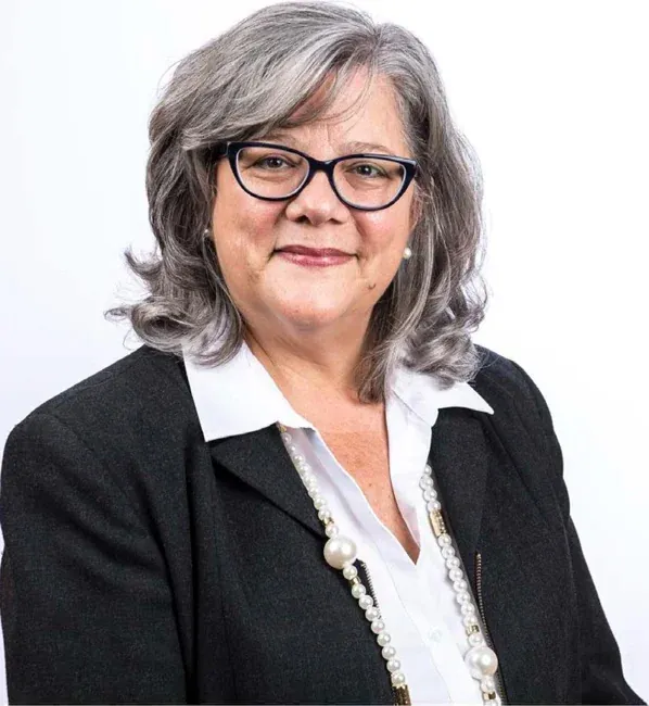 Corporate headshot on a plain white or gray background, selection 8