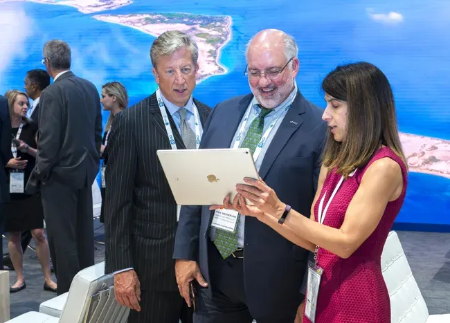 World Gas Conference — Attendees reviewing a tablet in the exhibition area