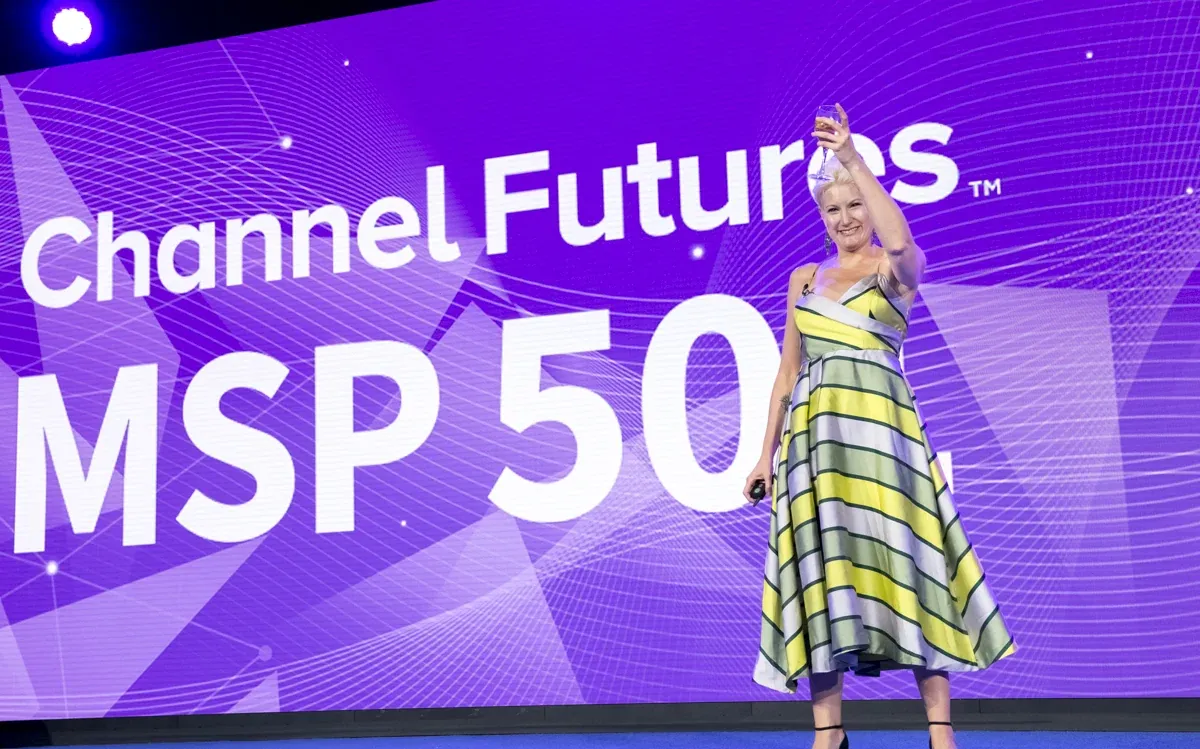 INFORMA stage moment against a vivid purple Channel Futures backdrop