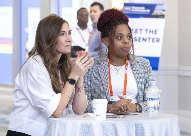 Merchant Advisory Group — Attendees listening during a session