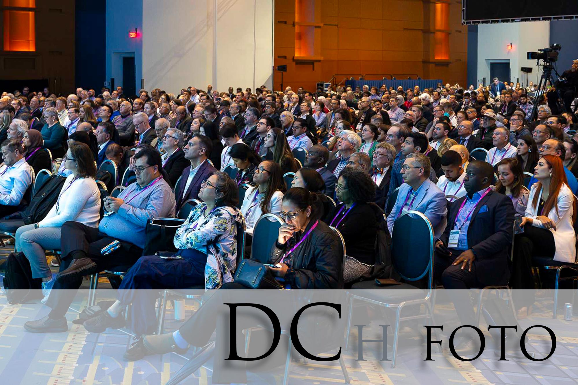 Conference photographer post-processing professional event photos from a Washington DC conference